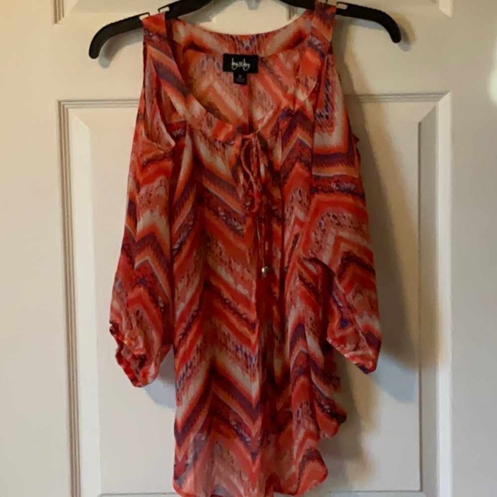 Beautiful-flowing cold shoulder top.